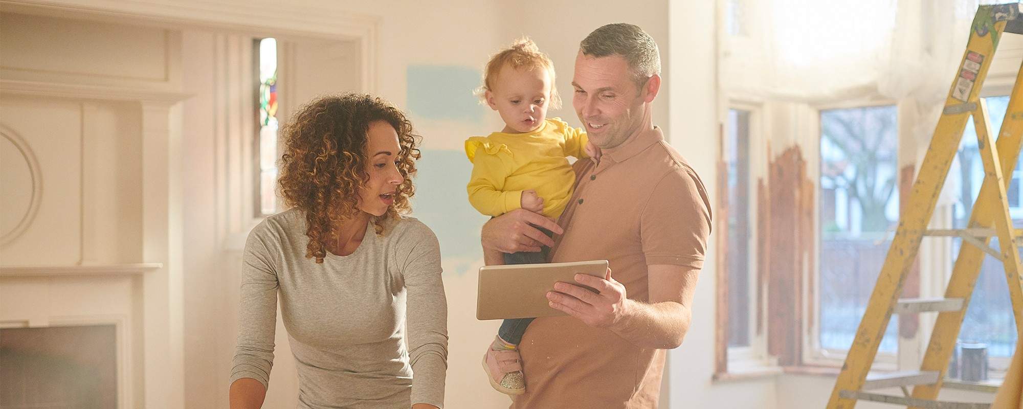 Dad Showing Something On His Tablet To His Wife and Kid - Loss Adjusting - McLarens